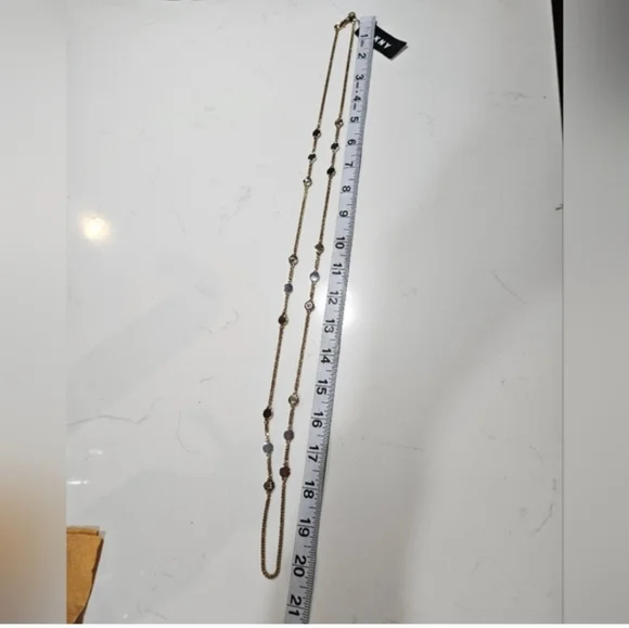 DKNY Tri Tone Crystal & Logo Disc 42" Statement Necklace - Picture 6 of 10